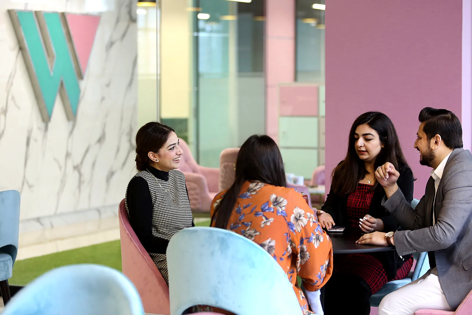 Founders discussing their startup in the TheWing.pk lounge