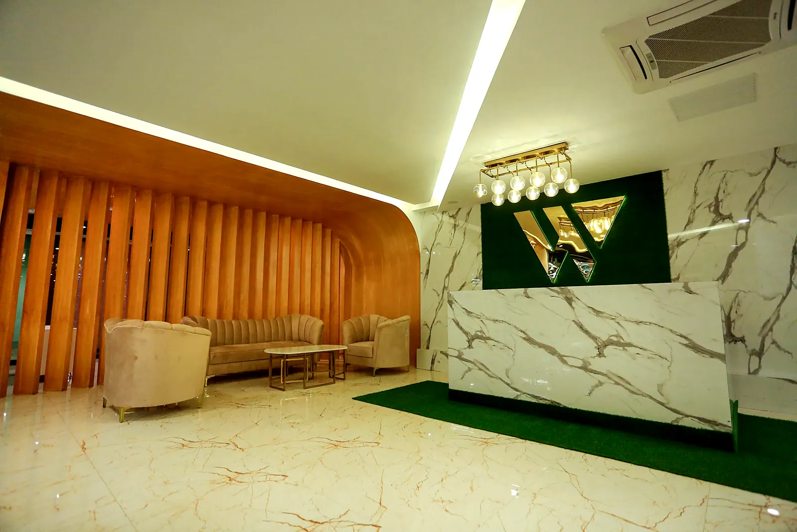 Reception and lounge with the TheWing.pk logo at Central Mall, DHA Phase 2, Islamabad